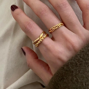 925 silver knot hollow gold rings on hand with winter sweater for minimalist styling