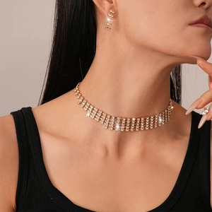 Detail of multi-row rhinestone choker and matching earrings set on gold base