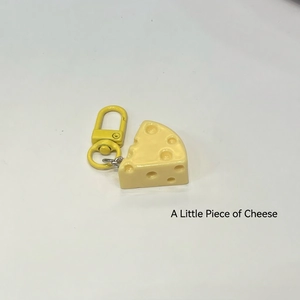Cute yellow cheese-shaped resin keychain with 3D holes and a matching metal swivel D-ring