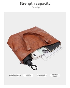 Macro view showing large capacity for laptop and daily items in vintage tote bag