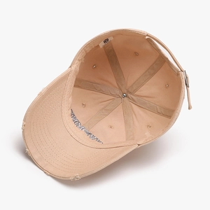 Distressed khaki baseball cap with internal stitching detail and adjustable metal buckle