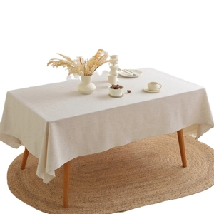 Nordic minimalist beige linen rectangular tablecloth styled on a dining table