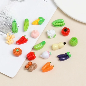 Miniature resin vegetable charms for DIY crafts and phone case decor set on a book