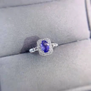 Macro shot of halo lavender purple gemstone ring with twisted band detailing