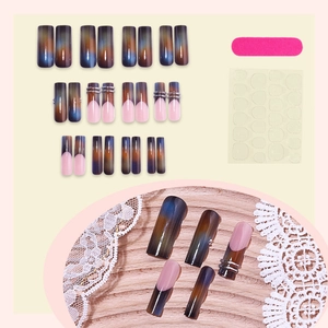 Blue and brown gradient press-on nails with silver stars and pink French tips