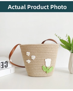 Detail shot of hand-woven cotton bucket bag with white crochet tulips and floral accents