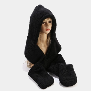 Detail of plush black hooded scarf and glove set in soft lamb wool material