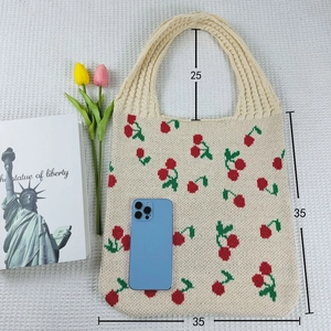 Knit tote bag size guide showing 35x35cm dimensions and cherry pattern detail