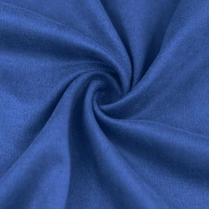 Detailed macro texture of navy blue faux suede fabric with soft microfiber ripples
