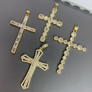 Detailed macro view of four hip hop cross pendants with sparkling cubic zirconia stones