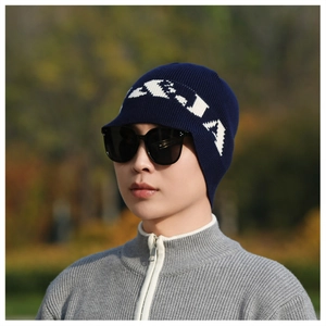 Detail of navy knit beanie with ear flaps and letter pattern for outdoor winter wear