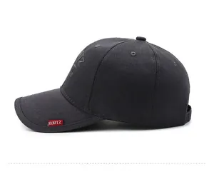 Detailed side view of a dark gray cotton baseball cap with red KURTZ woven label