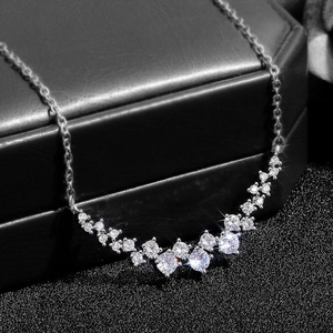 Sparkling zircon curved pendant necklace in silver finish on black jewelry box