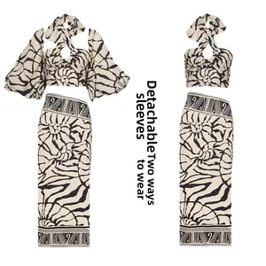 Detail view of the two-piece printed set with detachable sleeves and two wearing styles
