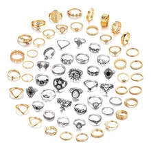 Assorted vintage bohemian rings with gold and silver finishes and inlaid gemstones