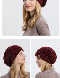 Detail of red and black knit beanie showing thick ribbed texture and slouchy fit design