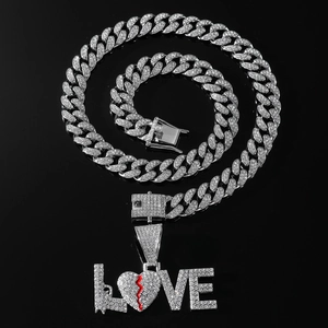 Hip-hop silver Cuban chain necklace featuring large iced-out LOVE pendant with red broken heart