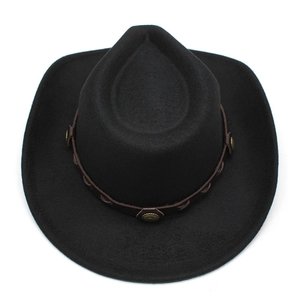 Detail of black wool cowboy hat with leather band and vintage gold metal rivets