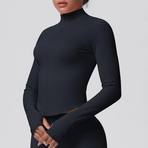 Detailed close-up of a black athletic jacket with stand collar, zipper, and thumbholes