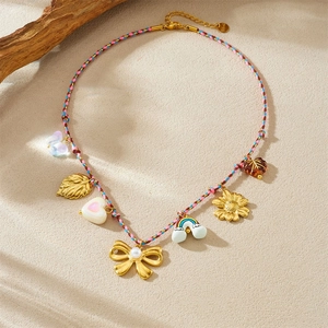 Bohemian woven rope necklace with gold pendants like sunflower, leaf, and butterfly