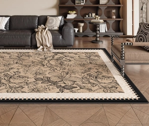 Detail of vintage French floral rug with black geometric borders in a modern living room