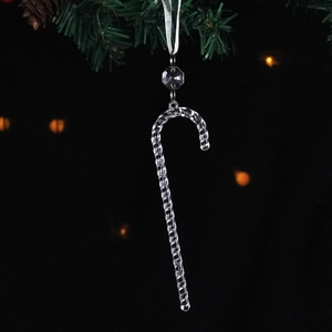 Clear acrylic candy cane ornament with crystal beads hanging on a Christmas tree