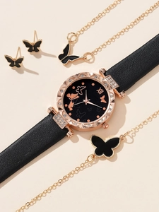 Detail view of butterfly jewelry set with rose gold watch, necklace and earrings