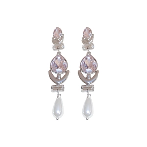 Elegant silver drop earrings with pink crystals and teardrop pearls on a white background