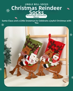 Detail of red and green plush Christmas stockings with 3D reindeer and Santa Claus