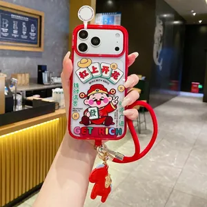 Detail of red iPhone case with Chinese God of Wealth, dragon charm and woven lanyard