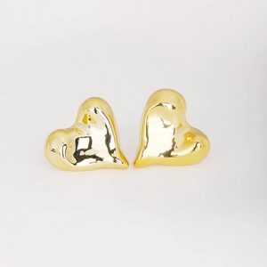 Polished gold heart-shaped stud earrings with a glossy finish and minimalist geometric style