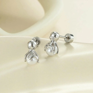Silver octopus stud earrings featuring white pearl accents and screw back design