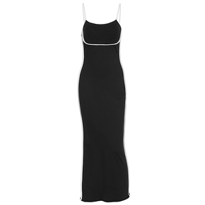 Detail of black bodycon midi dress with white contrast piping and thin shoulder straps