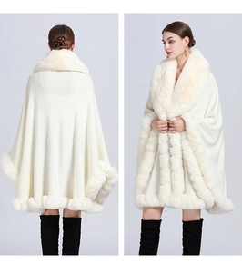 Front and back view of a white knitted cape with plush faux fur trim and elegant draping