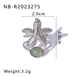 Detail view of starfish ring with green stone including 2.0cm and 2.6cm dimensions