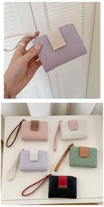 Macro shot of stylish floral embossed PU leather wallets in various pastel colors