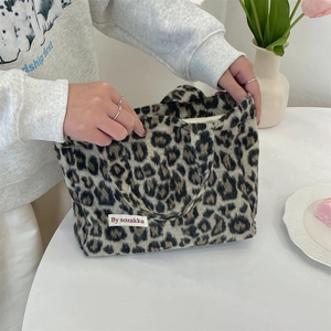 Close-up of leopard print plush tote bag interior with soft faux fur texture
