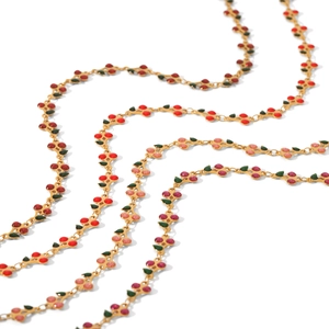 Gold cherry and leaf enamel necklace made of stainless steel displayed on a white background