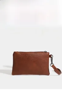 Close-up of litchi texture PU leather clutch with vintage metal zipper and wrist strap