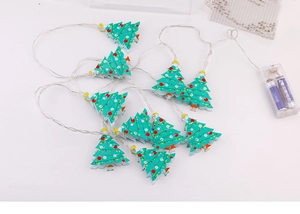 Macro detail of LED Christmas tree string lights with transparent battery box and AA cells