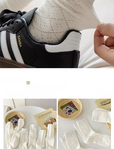 Close-up of white cotton mesh socks with bow detail and vintage INS style design
