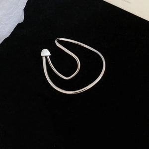 Detailed view of silver irregular twisted double hoop ear cuff with teardrop accent