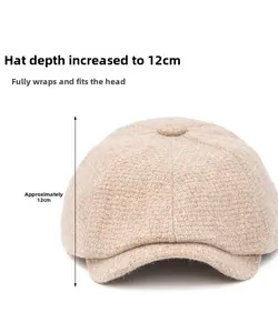 Detail of oatmeal knitted beret showing 12cm depth and snug fit design on white background
