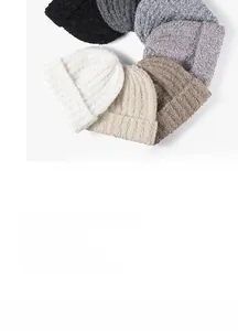 Detailed view of knitted beanie ribbed texture and folded brim in various colors