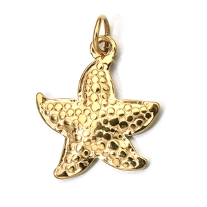 Macro detail of a golden starfish pendant with textured surface and top bail for jewelry