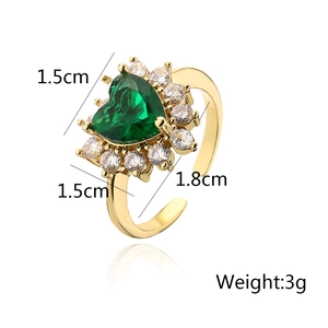 Detail shot of heart-shaped emerald zircon ring with dimension and weight markings