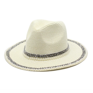 Detailed texture of cream fedora hat with elegant pearl and silver beaded trim