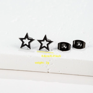 Detail view of 0.8cm black hollow star stud earrings with butterfly backs on stone