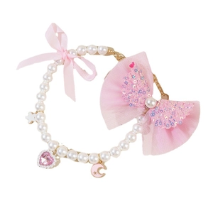 Pink ribbon bow cat necklace with white pearls and heart pendant on plain white background