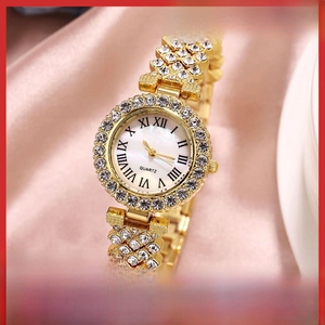Macro view of luxury quartz watch featuring rhinestone bezel and Roman numerals dial